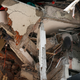 The body of woman hangs crushed by a collapsed building in the neighborhood of Roma Norte, in Mexico City. (Image: AP)